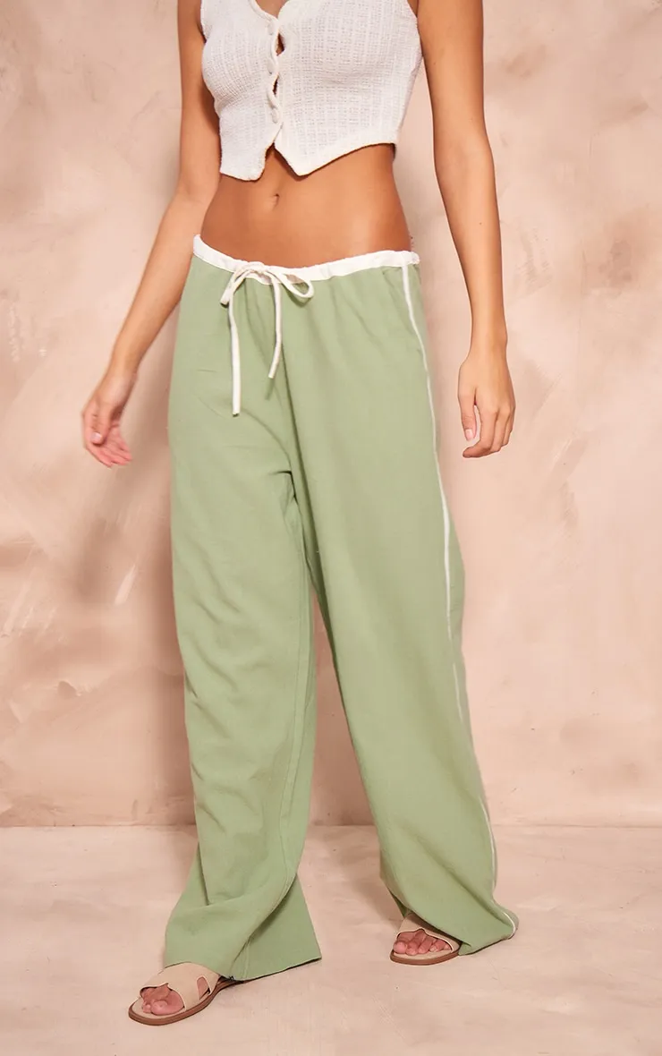 Pantalon en effet lin vert sauge à rayures contrastantes et cordons ajustables