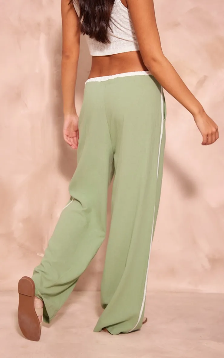 Pantalon en effet lin vert sauge à rayures contrastantes et cordons ajustables